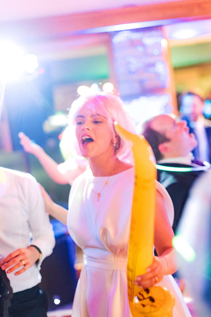 bride on the dace floor with her wedding party prop